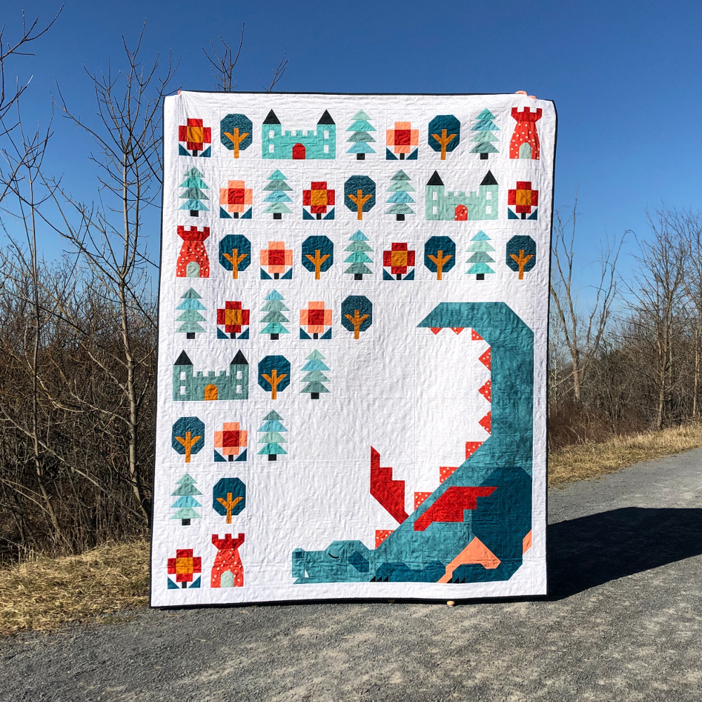 Dragon Dreams twin size quilt with village quilt blocks on gravel road