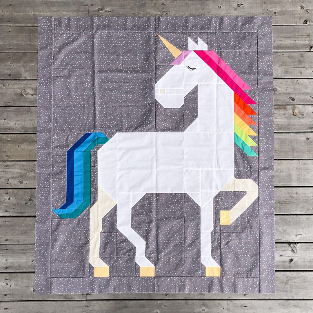 Unicorn Garden quilt top - toddler option featuring striped tail detail