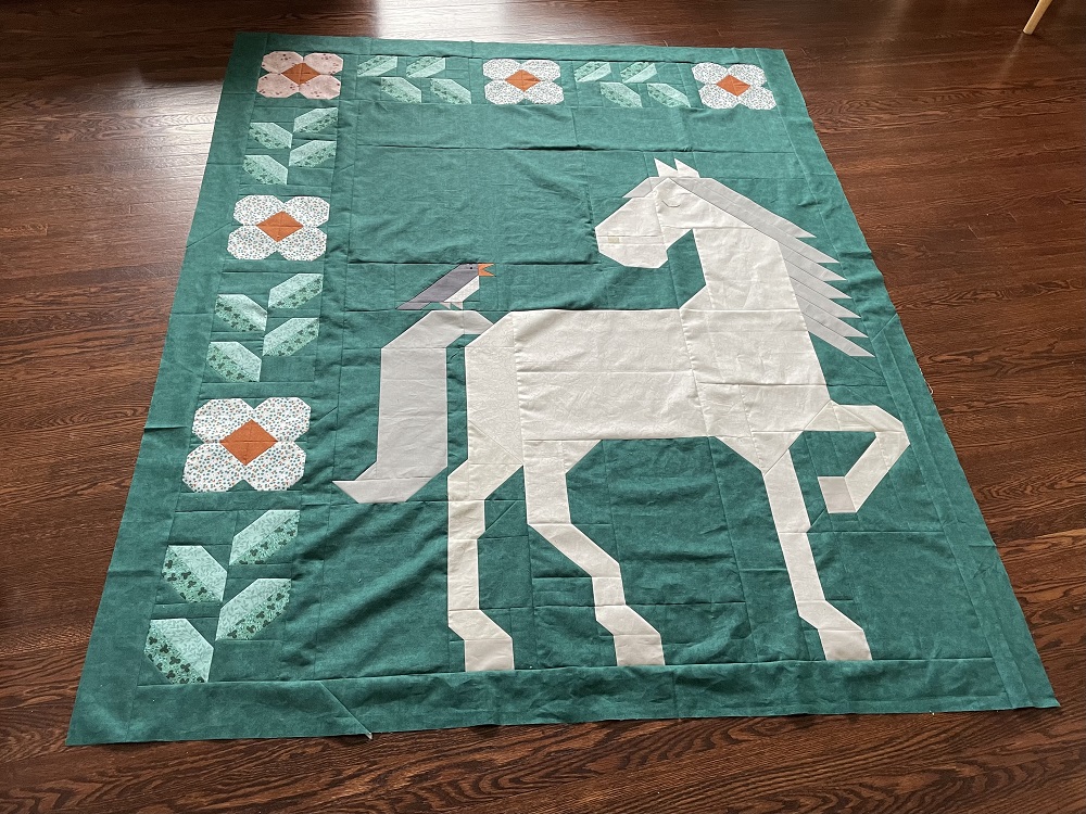 Unicorn Garden quilt top by Charlene H.