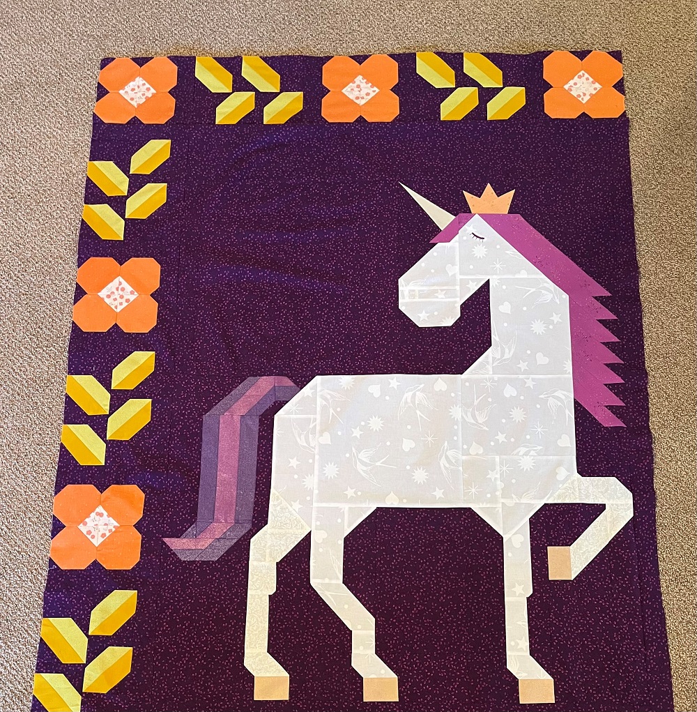 Unicorn Garden quilt top by Danette W.