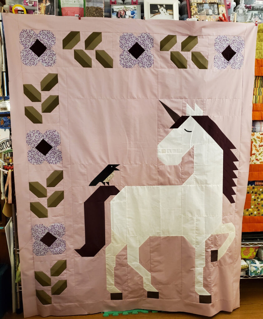 Unicorn Garden quilt top by Darcy B.