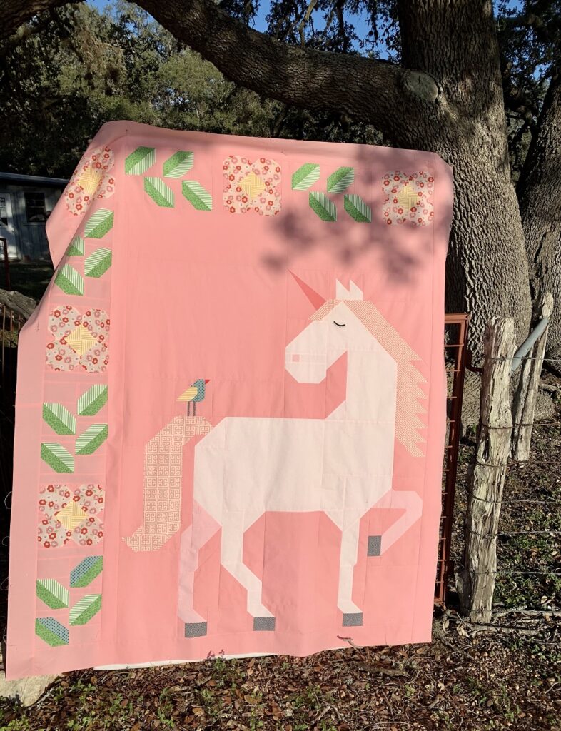 Unicorn Garden quilt top by Gina C.