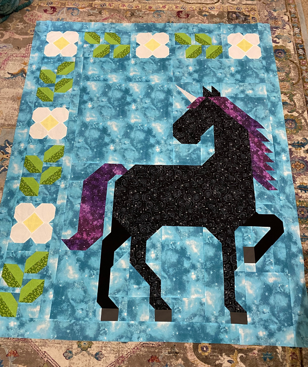 Unicorn Garden quilt top by Janelle T.