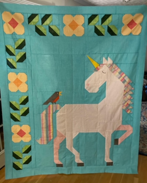 Unicorn Garden quilt top by Jody R.