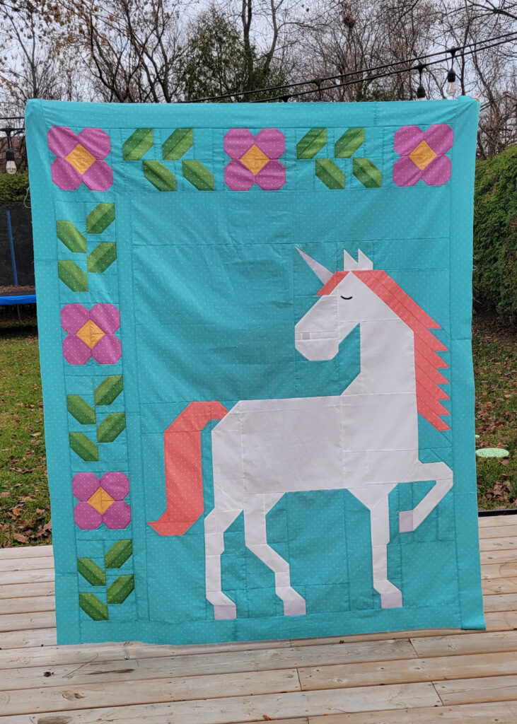 Unicorn Garden quilt top by Josiane G.
