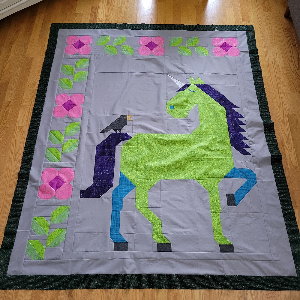 Unicorn Garden quilt top by Lesley B.