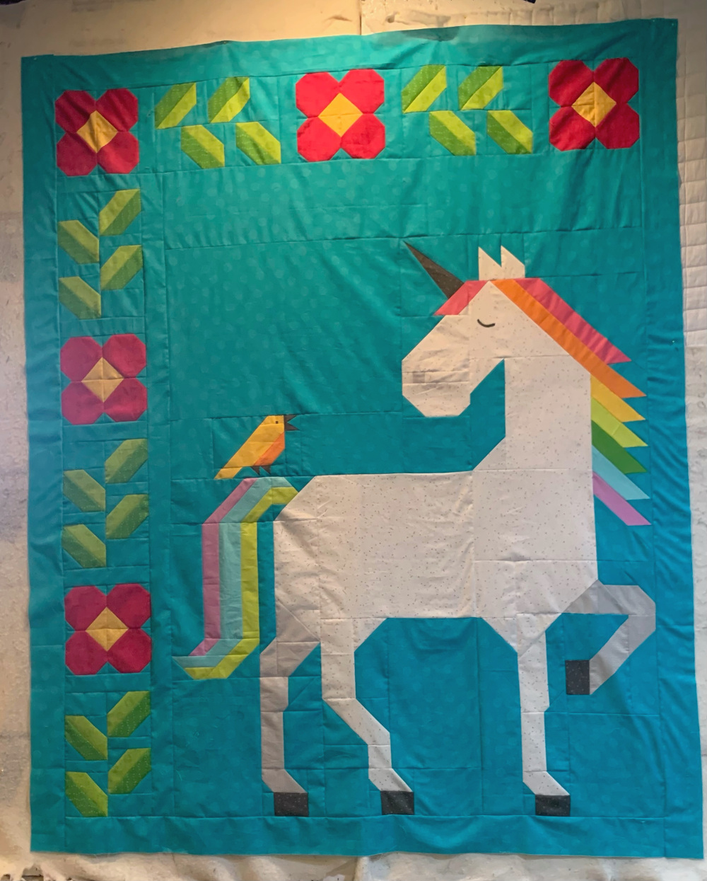 Unicorn Garden quilt top by Linda P.