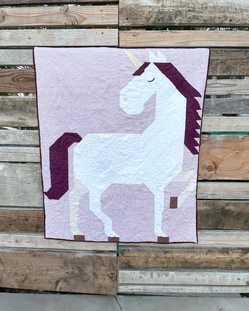 Unicorn Garden quilt top by Megan M.
