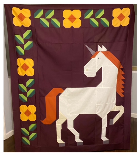 Unicorn Garden quilt top by Melissa P. (@melrainy.1)
