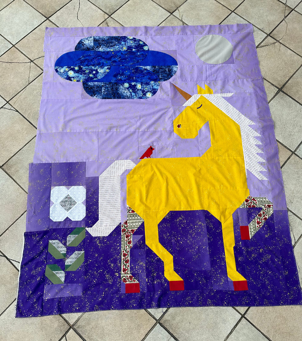 Unicorn Garden quilt top by Mimi G.
