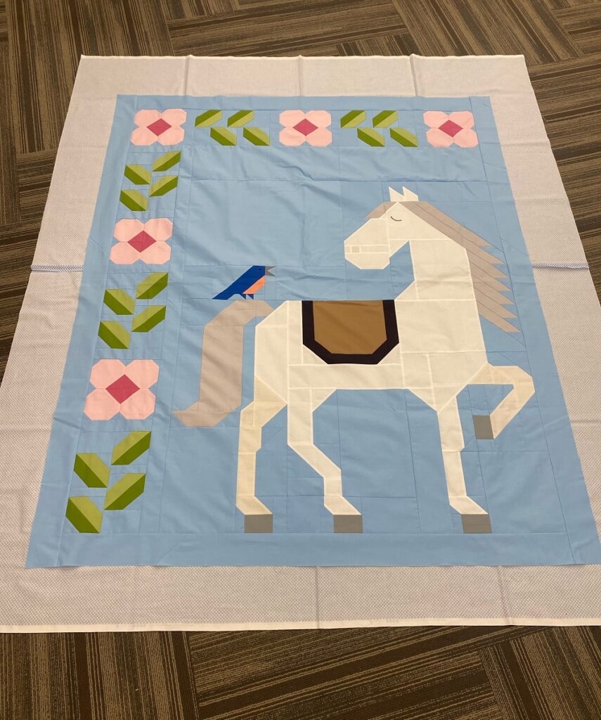 Unicorn Garden quilt top by Muriel T.