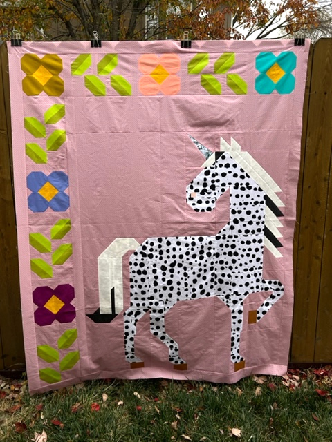 Unicorn Garden quilt top by Paula L.