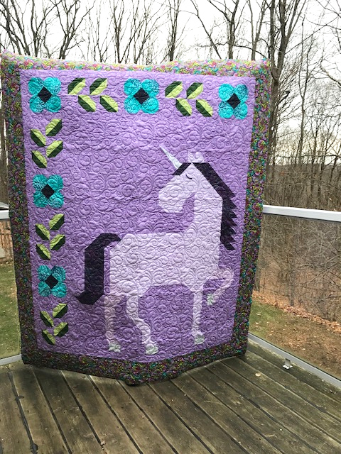 Unicorn Garden quilt top by Rosemary G.