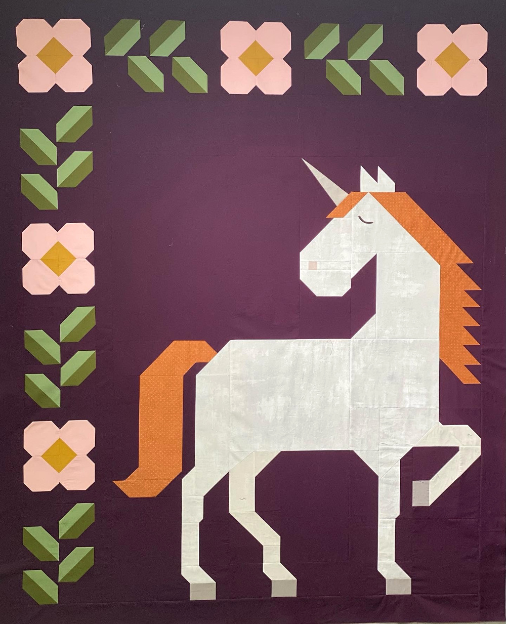 Unicorn Garden quilt top by Sabra H.