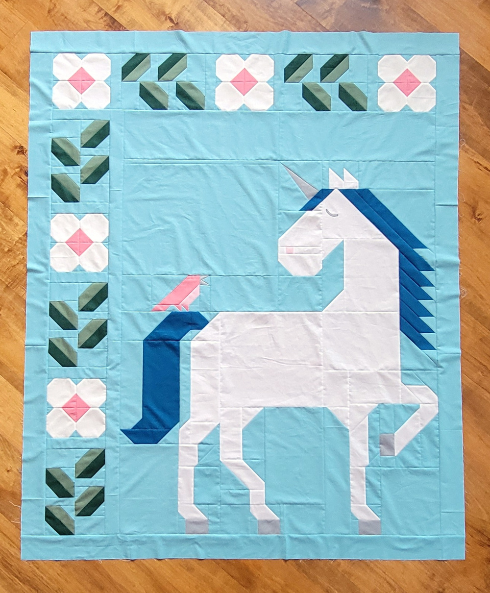 Unicorn Garden quilt top by Vicki W.
