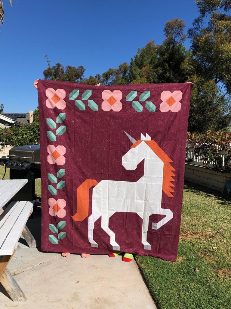 Unicorn Garden quilt top by Julie L.